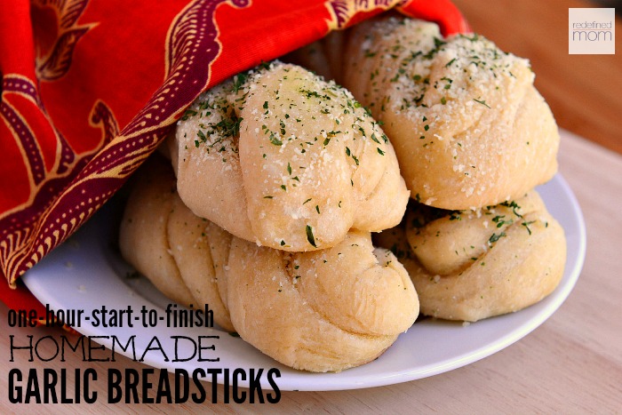 Breadsticks in one hour? You bet! This One-Hour Homemade Garlic Breadsticks Recipe is fast, easy, and guaranteed to be the breadsticks you will ever have. Take dinner up a notch for hardly any time at all!
