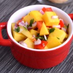 This Quick Easy 5 Ingredient Mango Salsa Recipe is TOO. DIE. FOR. Loaded with super fruits, under 150 calories per cup and full on taste...it's the perfect compliment to chicken, fish, or a handful of tortilla chips. Plus, if cutting a mango scares you.. this post will teach you how.