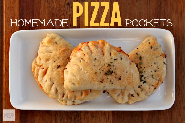 Need a after school snack or lunch option? This Homemade Pizza Pockets Freezer Meal Recipe is easy to make, freezes well, and can be doubled for large crowds. Say GOOD-BYE to snacks with names you can't pronounce and ingredients equally as weird and make this homemade pizza pickets freezer meal recipe instead.